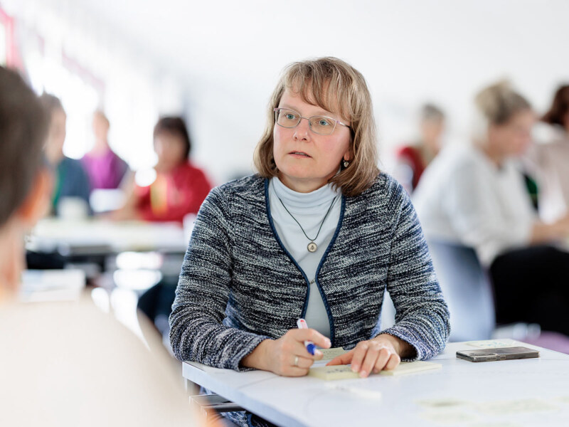 Gruppenarbeit bei einer Tagung. Eine Eventfotografie des Fotografen in Köln.